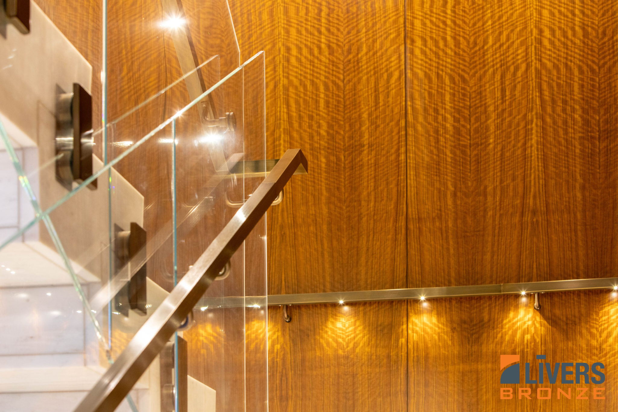 Livers Bronze Blok Commercial Glass Railing installed in the lobby of the Trammell Crow Center in downtown Dallas Texas and is made in the USA