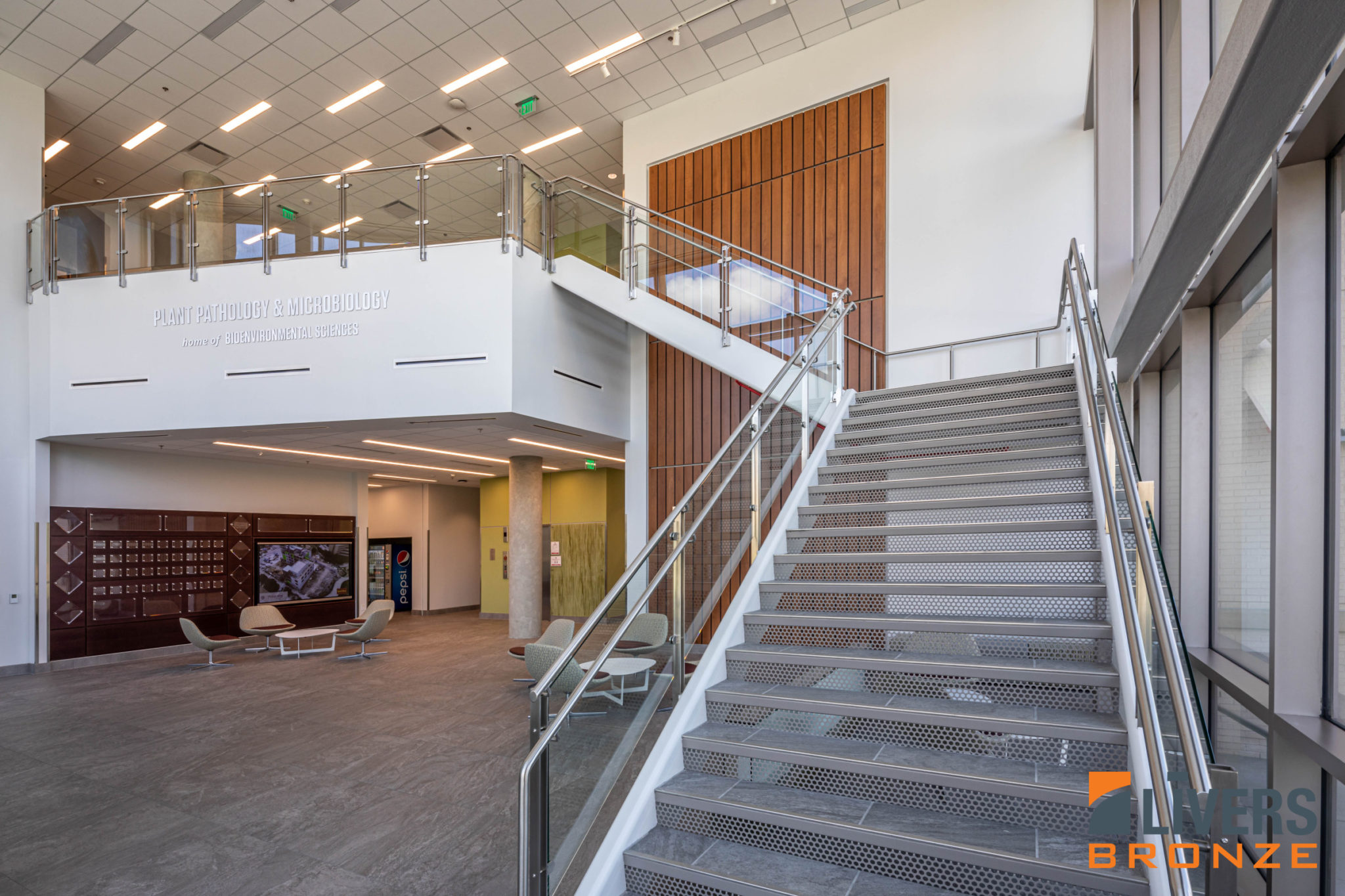 Livers Bronze Icon Glass Railings with laminated glass and Stainless Steel Railings were installed at the Lobby Stairs and Interior Balcony at the Student Library at Texas A&M University's Plant Pathology and Microbiology Building and were made in the USA.