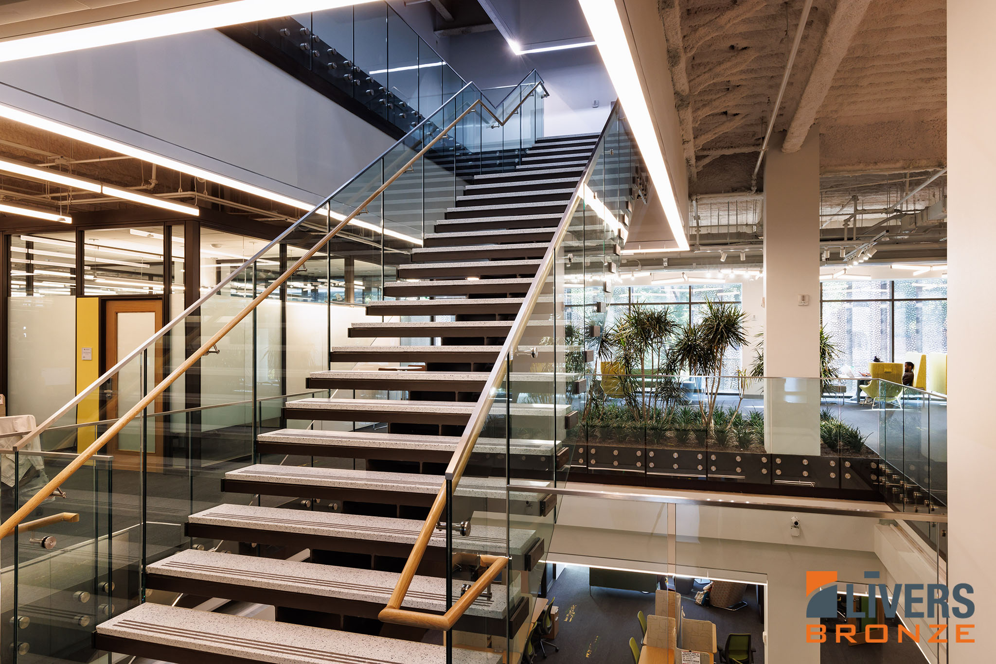 Livers Bronze Button Glass Railing System with laminated glass was installed at the lobby stairway at Lehigh University's Health, Science & Technology Building and is Made in the USA.