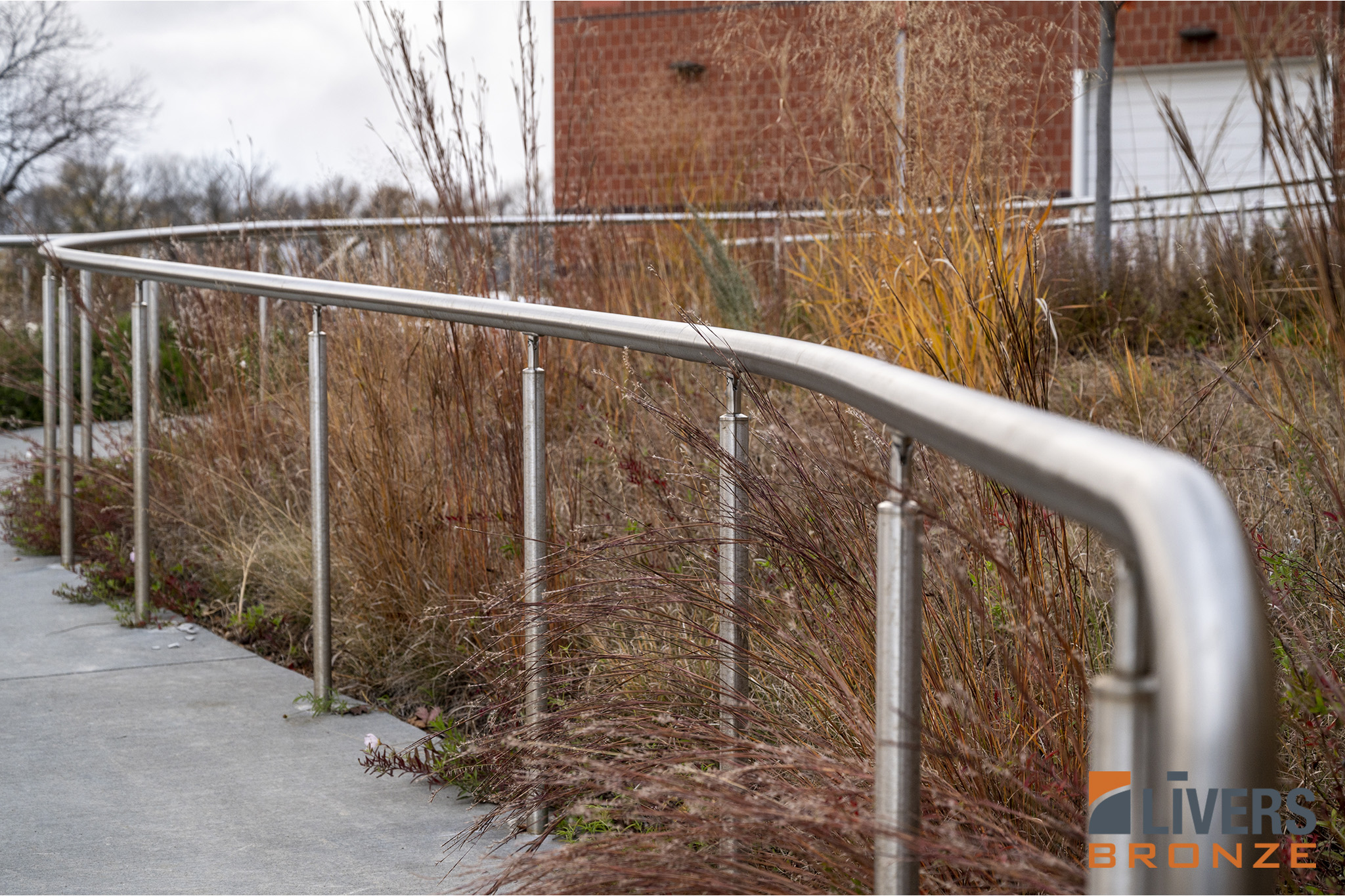 Livers Bronze Illume Puck LED curved railings were installed along the exterior pedestrian ramp at MidAmerican Energy Headquarters, Urbandale, Iowa, and were Made in the USA.
