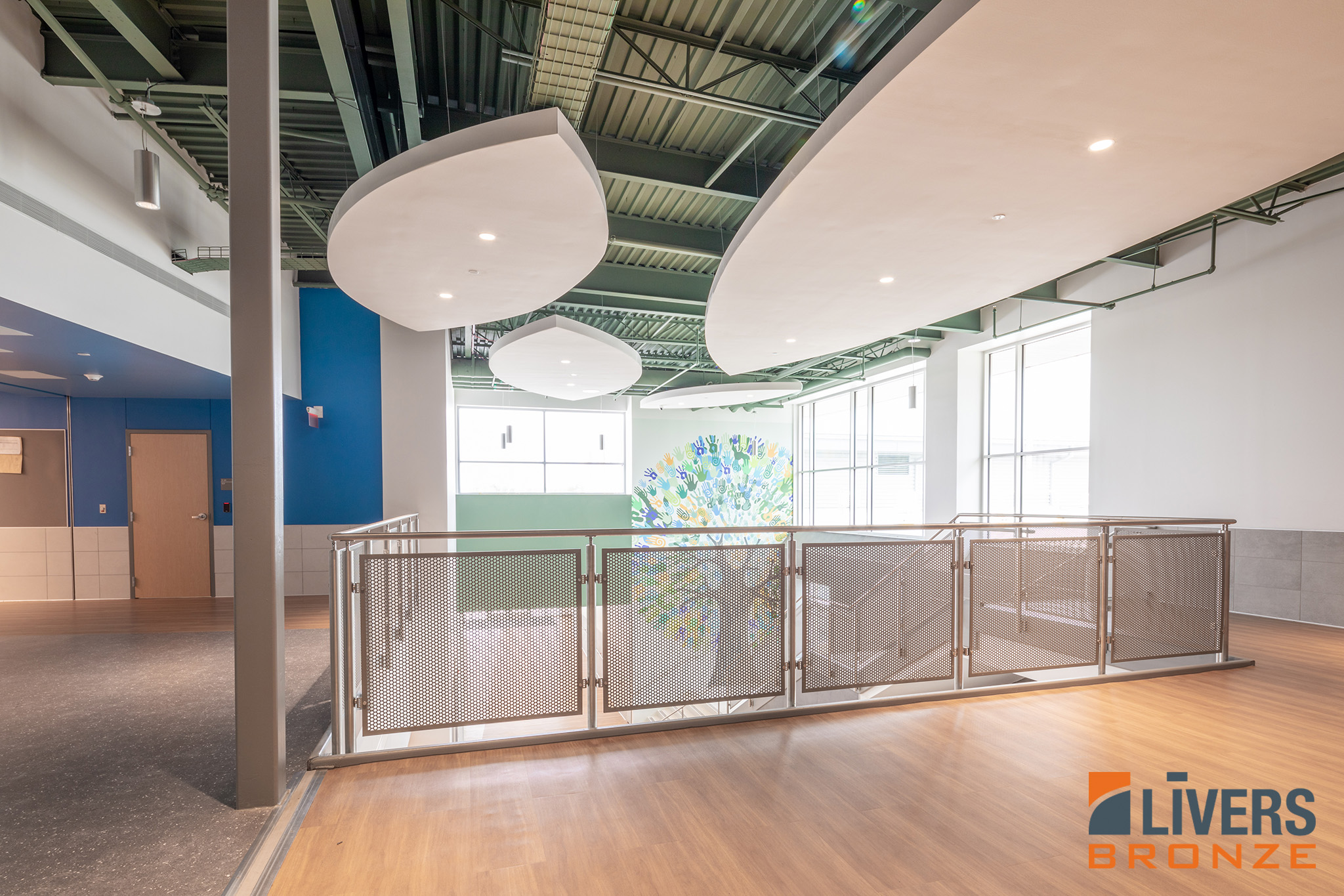 Livers Bronze Mirage Stainless Steel Railings with Decorative Perforated Panels were installed at the interior stairways and balconies at Red Bud Elementary School, Austin, Texas, and were Made in the USA
