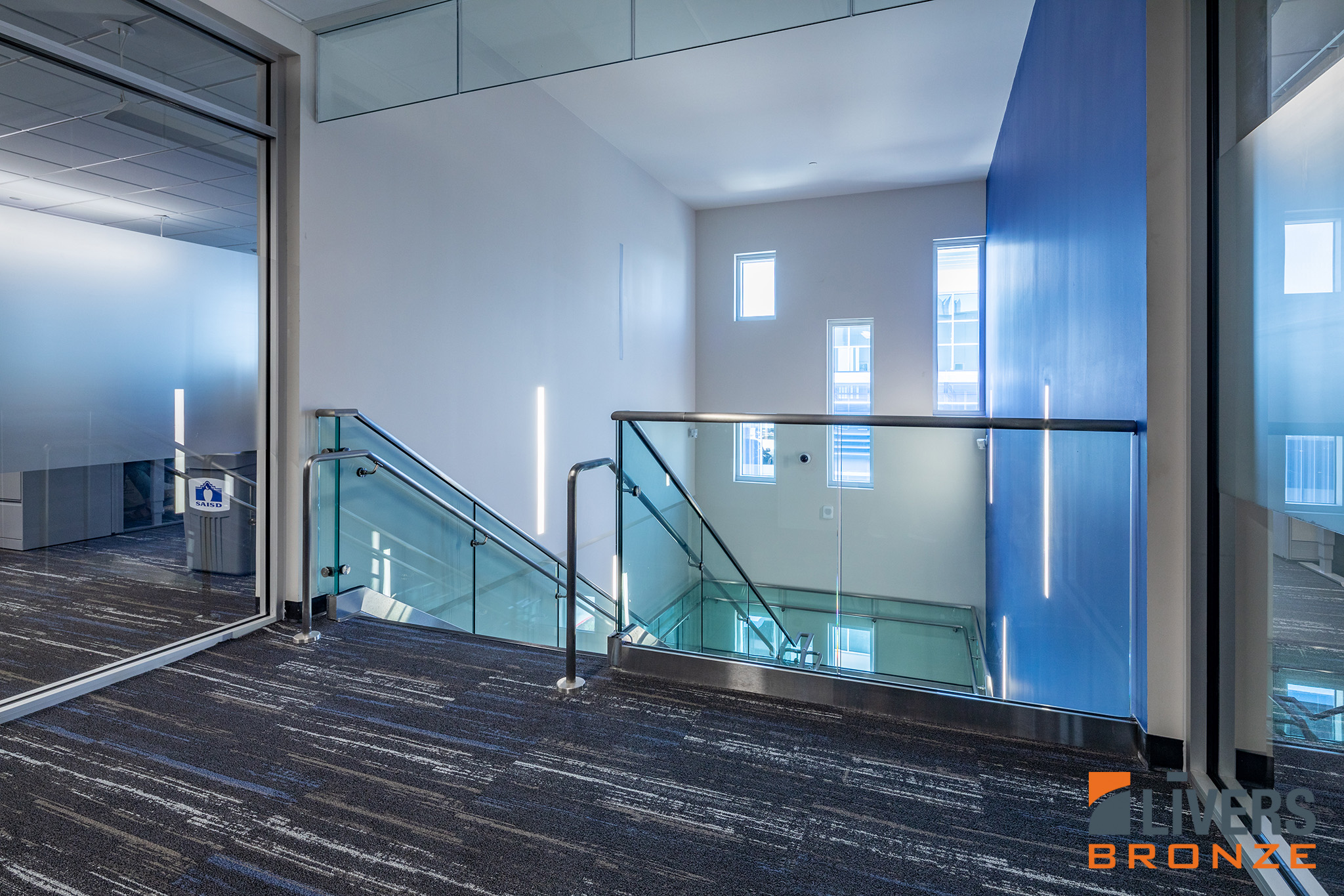 Livers Bronze Struct-U-Rail Commercial Glass Railing with laminated glass installed in San Antonio Independent School District Central Office Building is Made in the USA