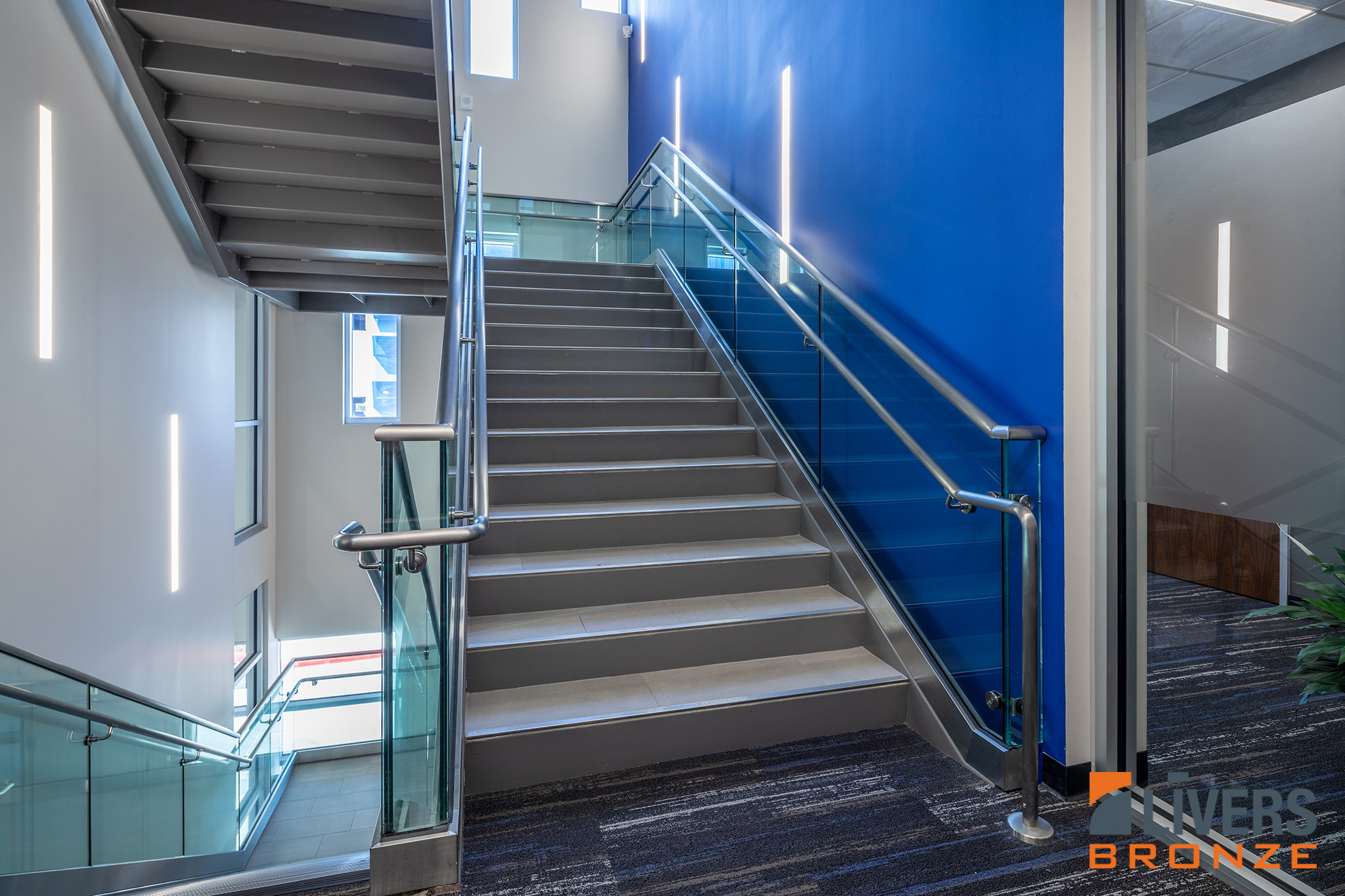 Livers Bronze Struct-U-Rail Commercial Glass Railing with laminated glass installed in San Antonio Independent School District Central Office Building is Made in the USA