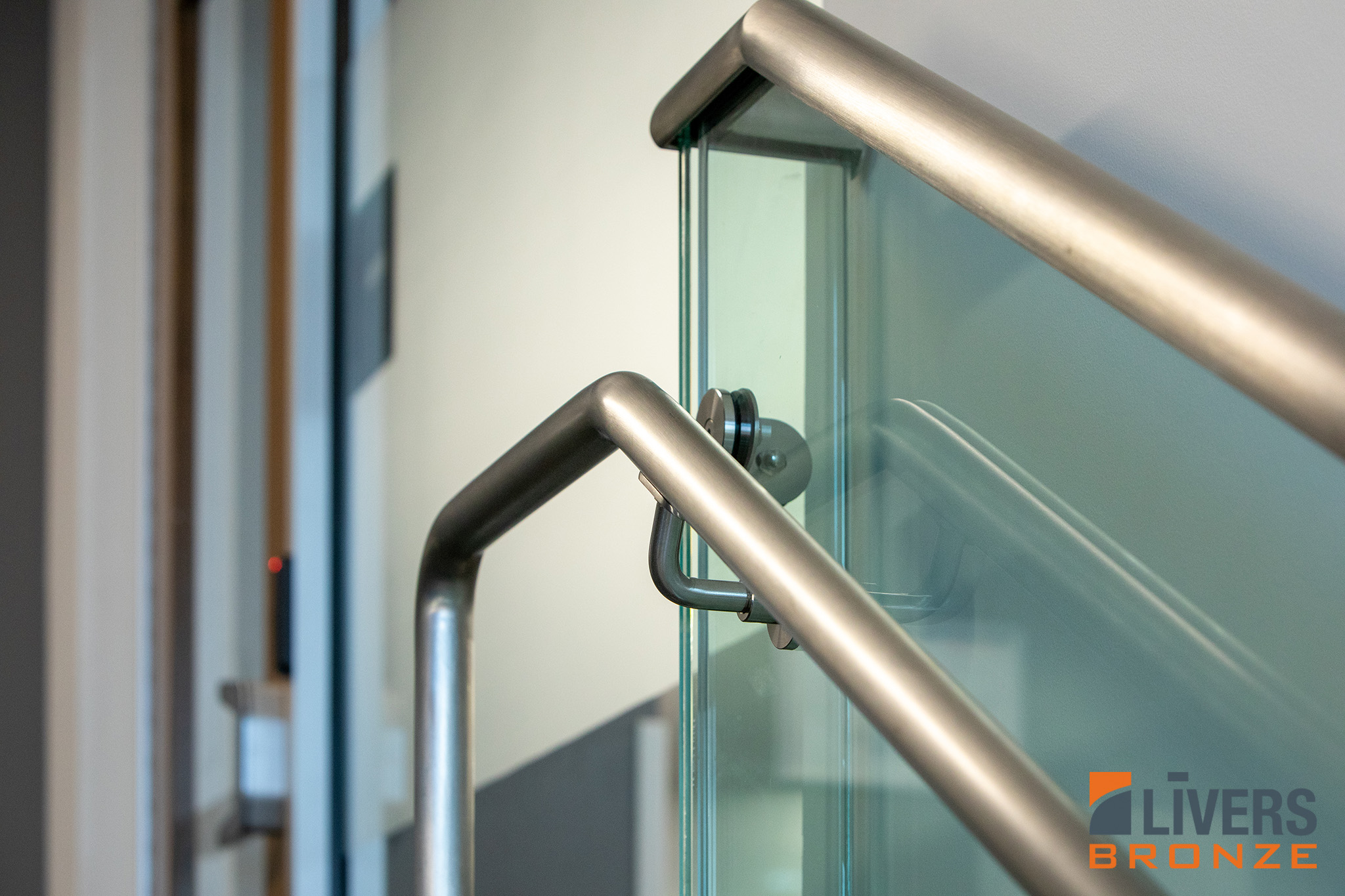 Livers Bronze Struct-U-Rail Commercial Glass Railing installed in San Antonio Independent School District Central Office Building is Made in the USA