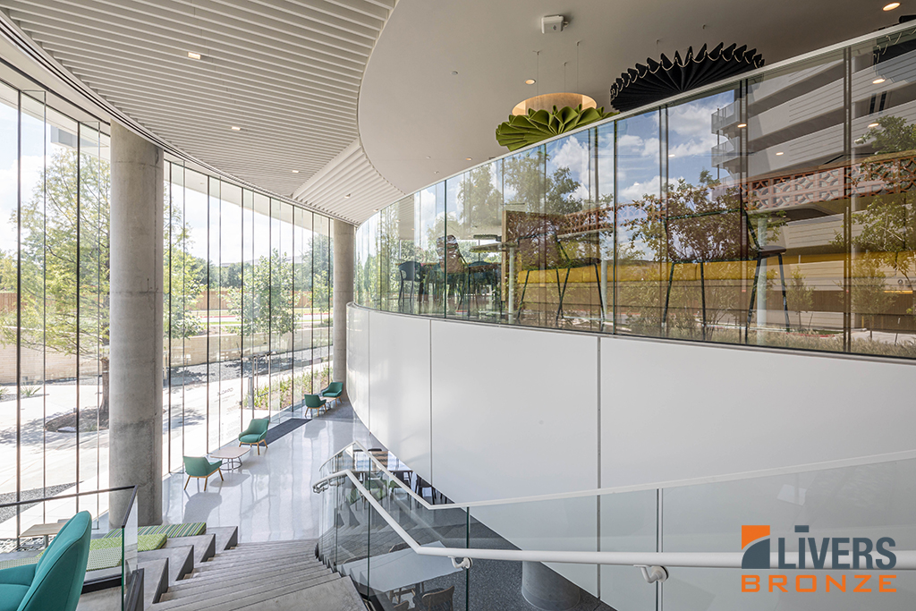Livers Bronze Struct-U-Rail Commercial Glass Railing System with laminated glass was installed at an office lobby stairway and was Made in the USA.