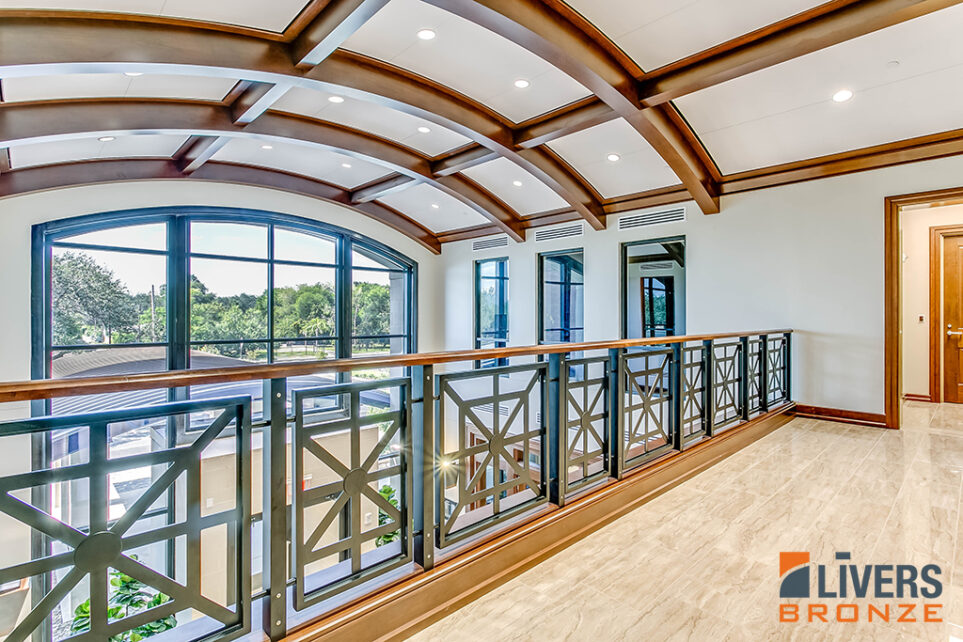 Livers Bronze Panel aluminum railings with hardwood top rail were installed at the interior balcony at Rio Bank, McAllen, Texas, and were Made in the USA.
