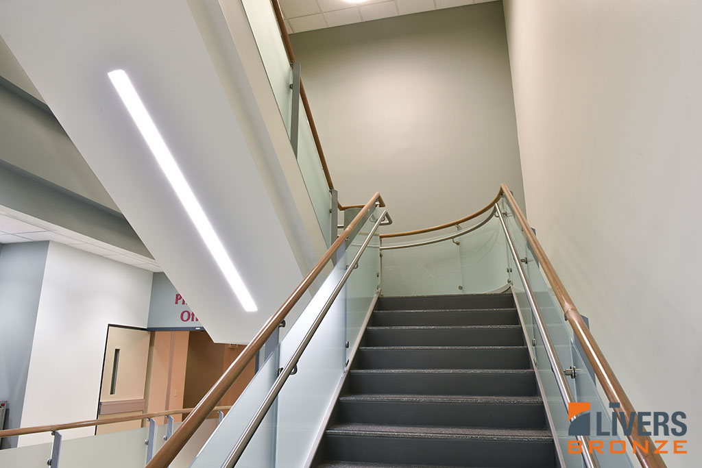 Livers Bronze Belmont steel railings with cherry top rail were installed at the lobby stair at the Upper Valley Medical Center in Troy, Ohio, and were Made in the USA.