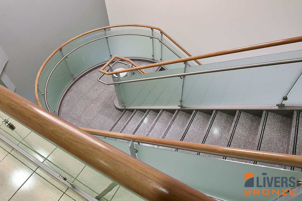 Livers Bronze Belmont steel railings with cherry top rail were installed at the lobby stair at the Upper Valley Medical Center in Troy, Ohio, and were Made in the USA.