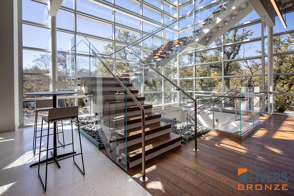 Livers Bronze Button glass railings were installed along the interior stairways at an office project, Austin, Texas, and were Made in the USA.