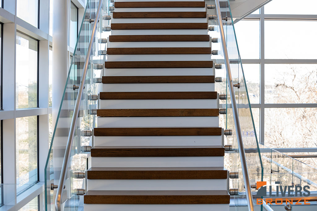 Livers Bronze Button glass railings were installed along the interior stairways at an office project, Austin, Texas, and were Made in the USA.