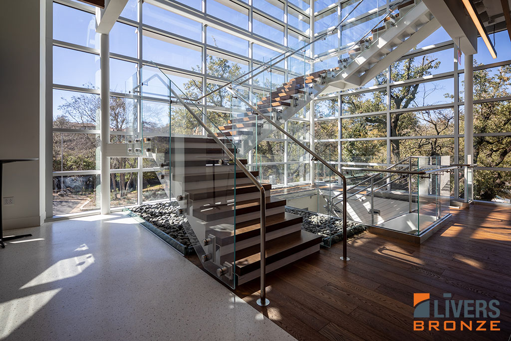 Livers Bronze Button glass railings were installed along the interior stairways at an office project, Austin, Texas, and were Made in the USA.