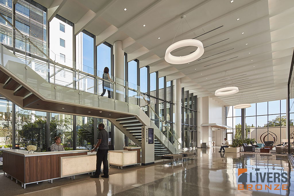 Livers Bronze Plank glass railings were installed at the lobby stair and interior balcony at Baptist MD Anderson Cancer Center and were Made in the USA.