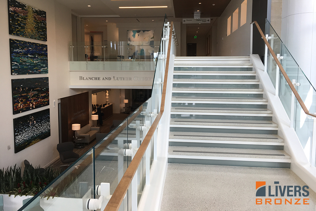 Livers Bronze Plank glass railings were installed at the lobby stair and interior balcony at Baptist MD Anderson Cancer Center and were Made in the USA.