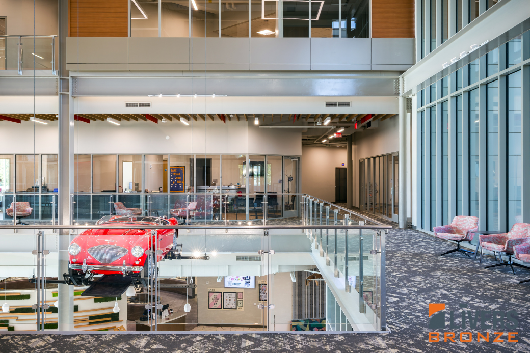 Livers Bronze glass railings and stainless steel railings were installed at the interior atrium balconies and stairways at the McPherson College Campus Commons and were Made in the USA.